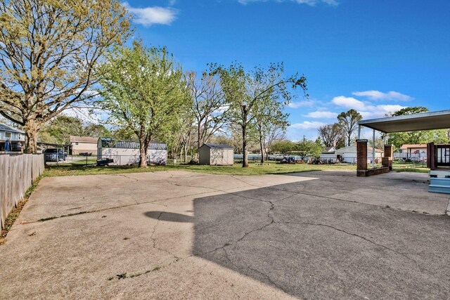 101 Walnut St, Smyrna, TN 37167 - view of parking / parking lot featuring a storage shed