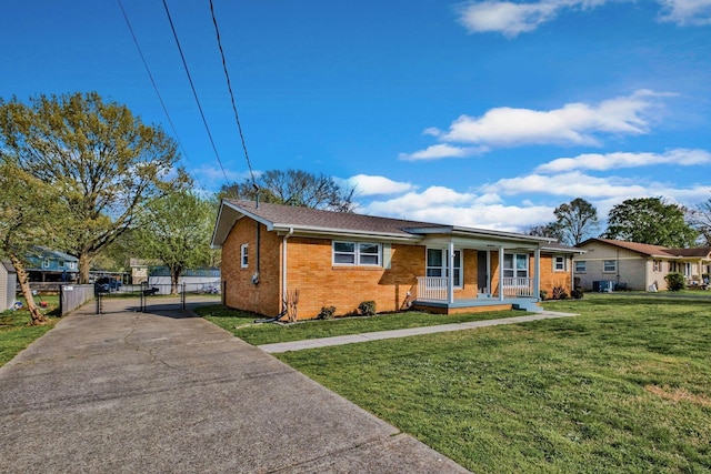 101 Walnut St, Smyrna, TN 37167 - single story home with a gate, covered porch, brick siding, and driveway