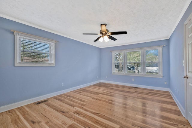 101 Walnut St, Smyrna, TN 37167 - empty room featuring ornamental molding, wood finished floors, baseboards, a ceiling fan, and a textured ceiling