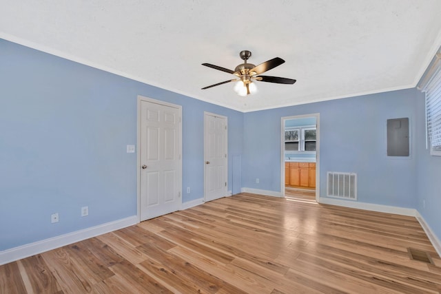 101 Walnut St, Smyrna, TN 37167 - unfurnished bedroom with baseboards, light wood-type flooring, crown molding, connected bathroom, and a ceiling fan