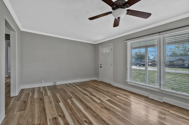 101 Walnut St, Smyrna, TN 37167 - empty room with wood finished floors, baseboards, ceiling fan, ornamental molding, and a textured ceiling