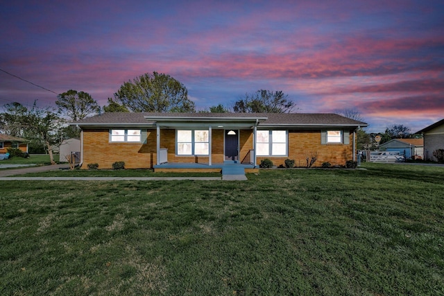 101 Walnut St, Smyrna, TN 37167 - ranch-style home with covered porch, a lawn, and brick siding