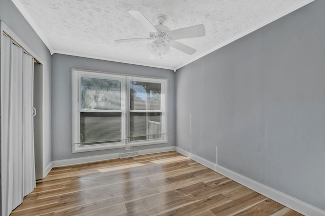101 Walnut St, Smyrna, TN 37167 - empty room featuring wood finished floors, ornamental molding, ceiling fan, baseboards, and a textured ceiling