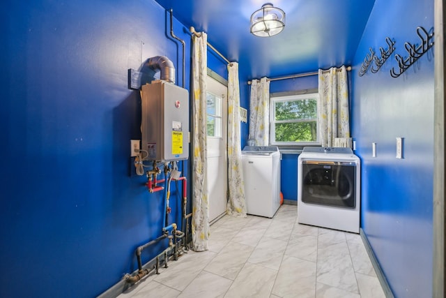 414 Ashe Ave, New Johnsonville, TN 37134 - laundry room featuring washer and dryer, water heater, marble finish floors, and baseboards
