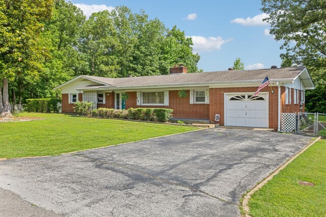 414 Ashe Ave, New Johnsonville, TN 37134 - ranch-style house featuring an attached garage, brick siding, asphalt driveway, a gate, and a chimney