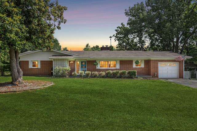 414 Ashe Ave, New Johnsonville, TN 37134 - ranch-style home featuring brick siding, an attached garage, a yard, and driveway