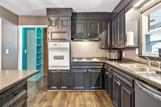 414 Ashe Ave, New Johnsonville, TN 37134 - kitchen with white appliances, a sink, under cabinet range hood, and dark wood-type flooring