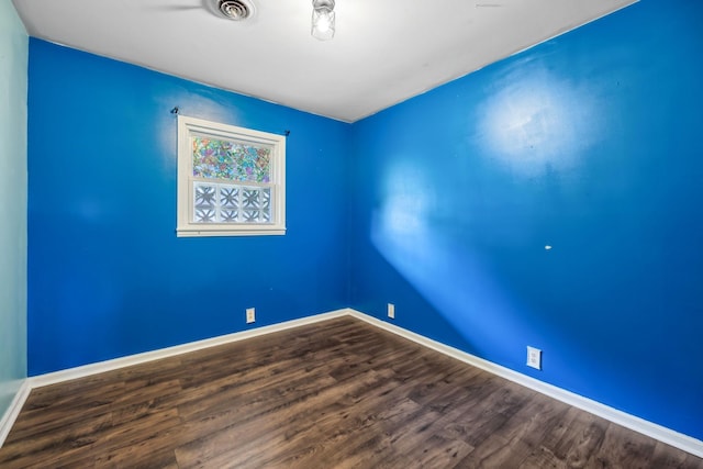 414 Ashe Ave, New Johnsonville, TN 37134 - spare room with dark wood finished floors and baseboards
