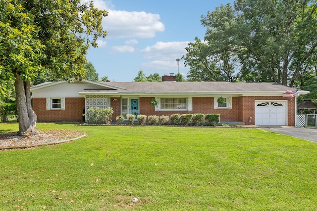 414 Ashe Ave, New Johnsonville, TN 37134 - view of front of home featuring an attached garage, brick siding, asphalt driveway, and a front yard