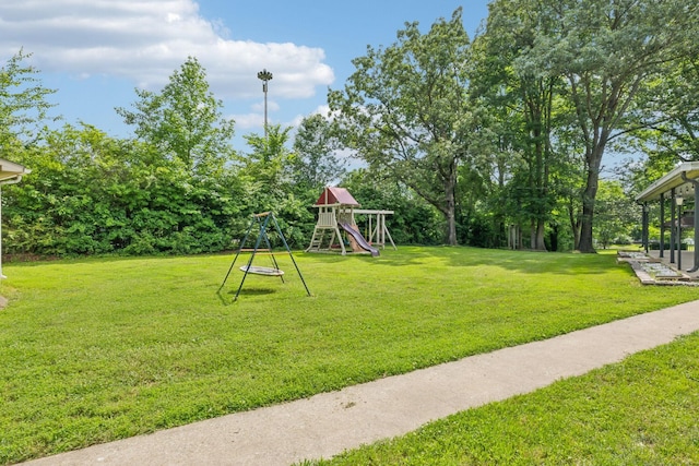 414 Ashe Ave, New Johnsonville, TN 37134 - view of green lawn with a playground