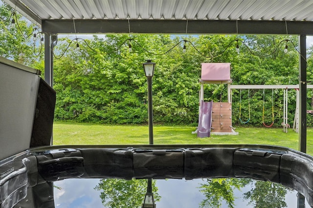 414 Ashe Ave, New Johnsonville, TN 37134 - view of patio featuring a playground and view of wooded area