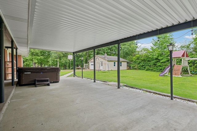 414 Ashe Ave, New Johnsonville, TN 37134 - view of patio / terrace featuring a hot tub and a playground