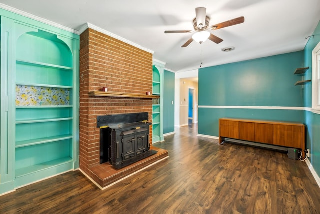 414 Ashe Ave, New Johnsonville, TN 37134 - unfurnished living room featuring built in shelves, a ceiling fan, wood finished floors, baseboards, and crown molding