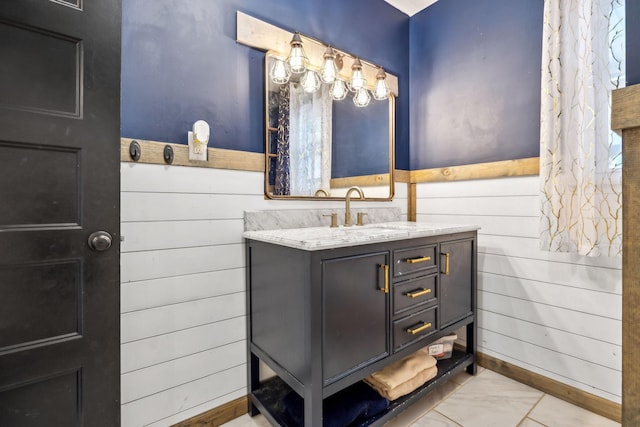 414 Ashe Ave, New Johnsonville, TN 37134 - bathroom featuring vanity, wooden walls, and a wainscoted wall
