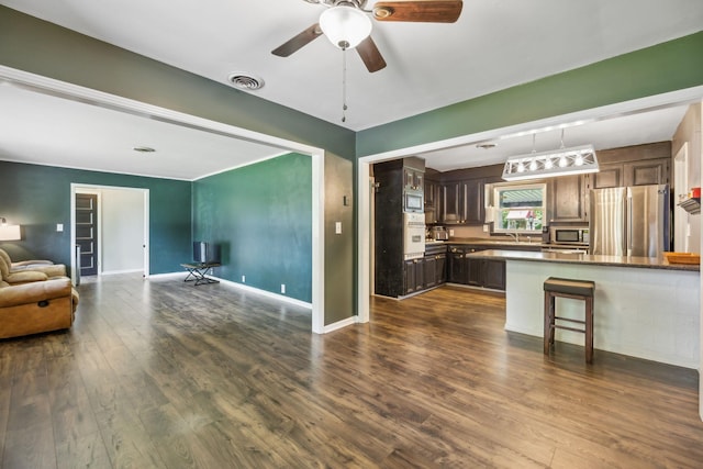 414 Ashe Ave, New Johnsonville, TN 37134 - living area featuring ceiling fan, dark wood finished floors, and baseboards