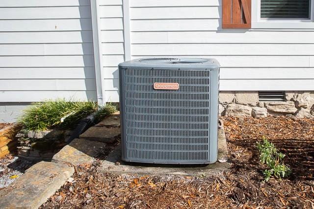 6684 Eudailey Covington Rd, College Grove, TN 37046 - exterior view of central AC unit and crawl space