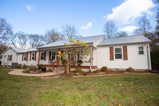 6684 Eudailey Covington Rd, College Grove, TN 37046 - ranch-style house featuring crawl space, a front yard, a porch, metal roof, and central air condition unit