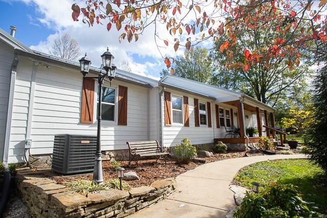 6684 Eudailey Covington Rd, College Grove, TN 37046 - view of property exterior featuring central AC and a porch