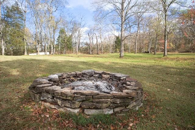 6684 Eudailey Covington Rd, College Grove, TN 37046 - view of green lawn featuring an outdoor fire pit