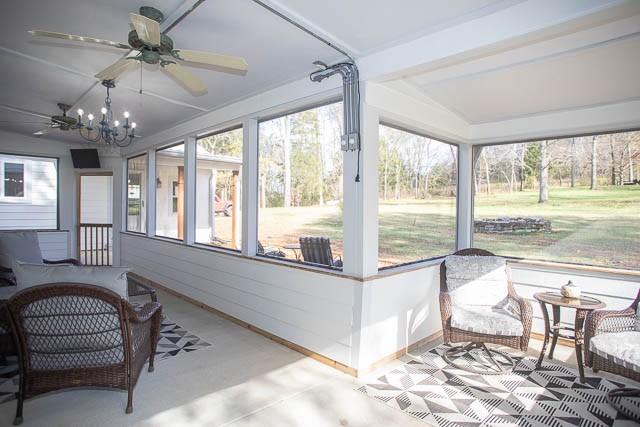 6684 Eudailey Covington Rd, College Grove, TN 37046 - sunroom / solarium with a ceiling fan and a chandelier