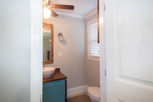 6684 Eudailey Covington Rd, College Grove, TN 37046 - half bath with vanity, toilet, a ceiling fan, ornamental molding, and baseboards