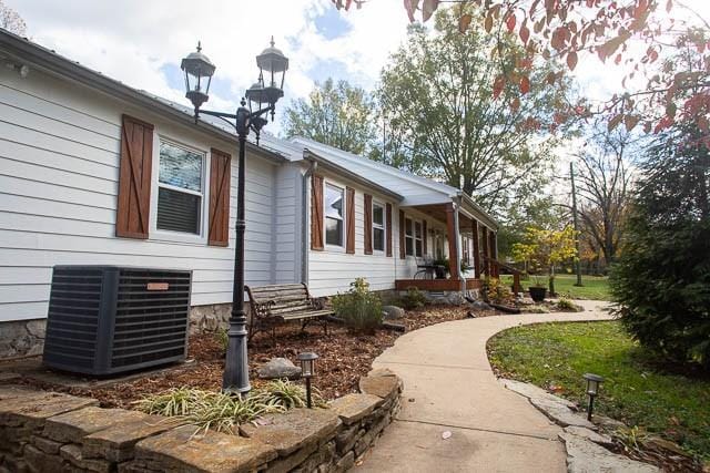 6684 Eudailey Covington Rd, College Grove, TN 37046 - view of home's exterior with central AC unit and covered porch