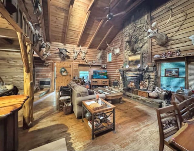 268 Sugar Maple Dr, Dover, TN 37058 - living area featuring hardwood / wood-style floors, high vaulted ceiling, wood ceiling with exposed beams, a stone fireplace, and ceiling fan