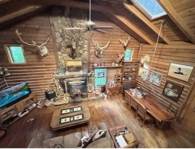 268 Sugar Maple Dr, Dover, TN 37058 - living area with a skylight, hardwood / wood-style flooring, ceiling fan, wooden walls, and wood ceiling
