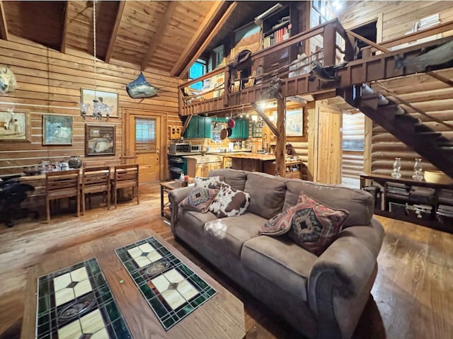 268 Sugar Maple Dr, Dover, TN 37058 - living area featuring high vaulted ceiling, wood walls, hardwood / wood-style flooring, wooden ceiling with exposed beams, and stairway