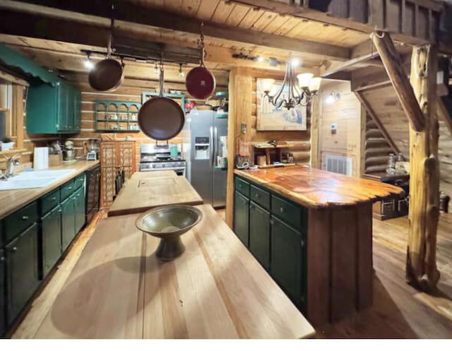 268 Sugar Maple Dr, Dover, TN 37058 - kitchen with butcher block counters, appliances with stainless steel finishes, a sink, light wood-style floors, and green cabinetry