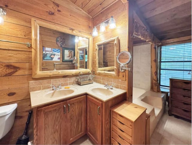268 Sugar Maple Dr, Dover, TN 37058 - bathroom featuring wood ceiling, toilet, double vanity, lofted ceiling, and wooden walls