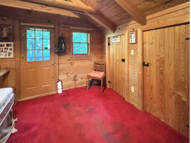 268 Sugar Maple Dr, Dover, TN 37058 - foyer entrance featuring wooden walls, carpet, and wooden ceiling with exposed beams
