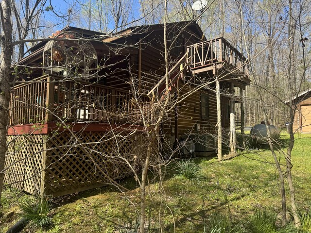 268 Sugar Maple Dr, Dover, TN 37058 - view of side of property featuring a lawn and a deck