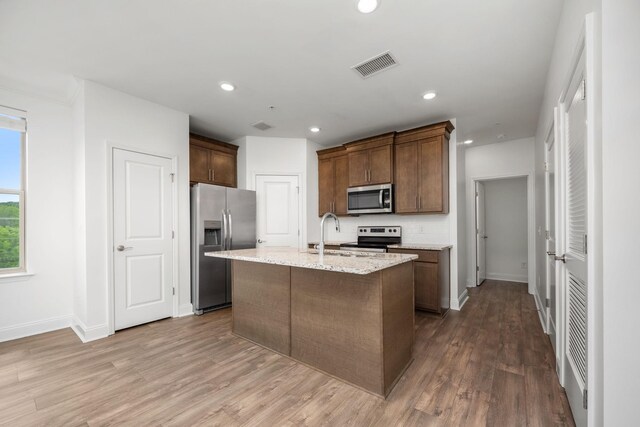 1021 Vida Way Unit 202, Nolensville, TN 37135 - kitchen with appliances with stainless steel finishes, wood finished floors, tasteful backsplash, baseboards, and recessed lighting