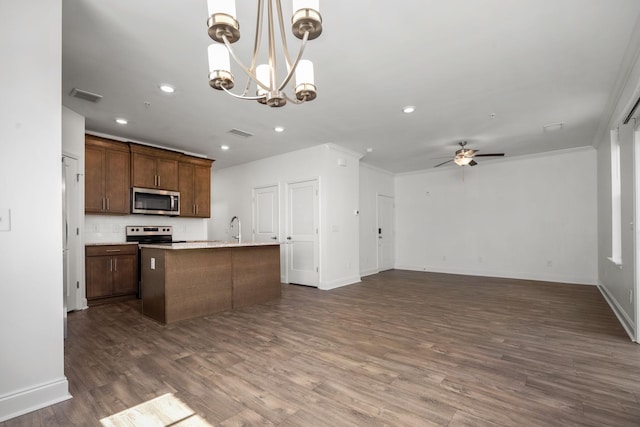 1021 Vida Way Unit 202, Nolensville, TN 37135 - kitchen with appliances with stainless steel finishes, dark wood finished floors, an island with sink, recessed lighting, and open floor plan