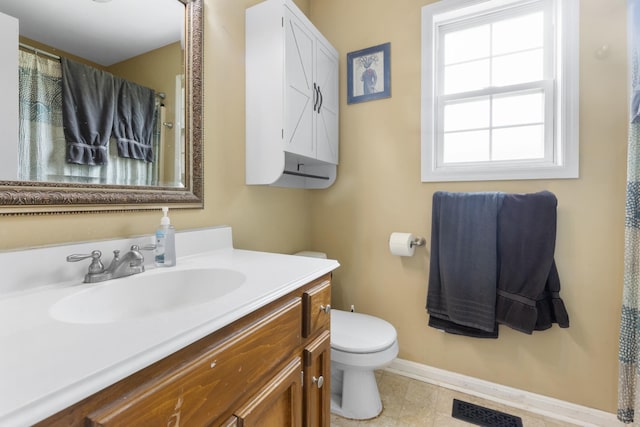 221 Pitts Ave, Old Hickory, TN 37138 - bathroom with toilet, vanity, baseboards, and tile patterned floors