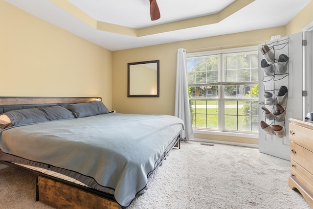 221 Pitts Ave, Old Hickory, TN 37138 - carpeted bedroom featuring multiple windows, a tray ceiling, and ceiling fan