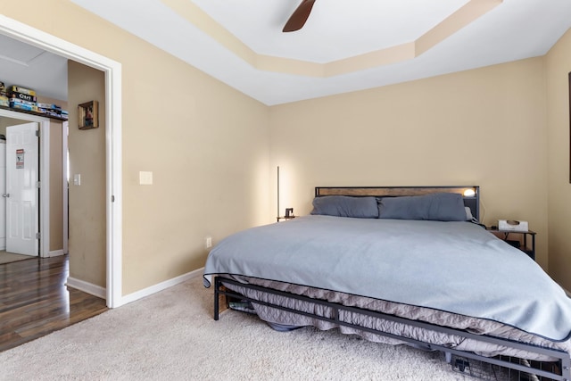 221 Pitts Ave, Old Hickory, TN 37138 - bedroom featuring baseboards, a ceiling fan, a raised ceiling, carpet floors, and wood finished floors