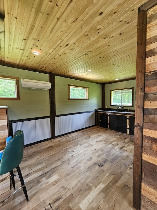 200 Caney Bend Rd, Doyle, TN 38559 - unfurnished office with a wall unit AC, wood finished floors, wooden ceiling, and healthy amount of natural light