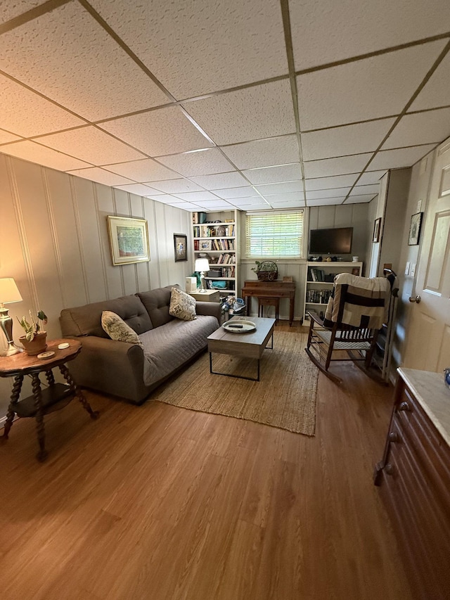 3508 General Bate Dr, Nashville, TN 37204 - living area featuring wood finished floors, a paneled ceiling, and a decorative wall