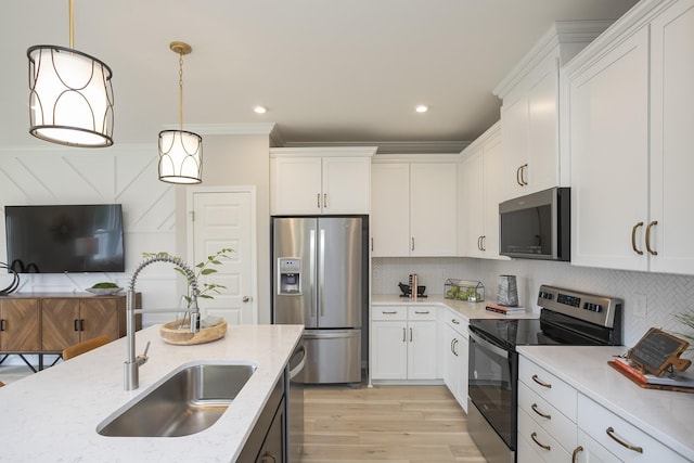 5047 Dayflower Dr, Hermitage, TN 37076 - kitchen with appliances with stainless steel finishes, a sink, white cabinetry, light stone counters, and recessed lighting
