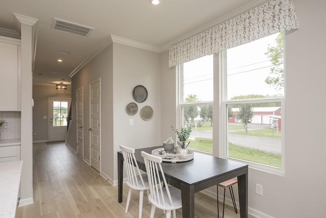 5047 Dayflower Dr, Hermitage, TN 37076 - dining area featuring crown molding, light wood-style floors, baseboards, and recessed lighting
