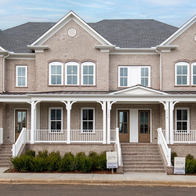 3180 Long Branch Cir, Franklin, TN 37064 - view of front facade with a porch, stairway, brick siding, and roof with shingles
