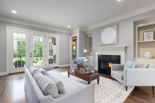 1825 Barnstaple Ln, Brentwood, TN 37027 - living room featuring ornamental molding, built in shelves, dark wood finished floors, french doors, and recessed lighting