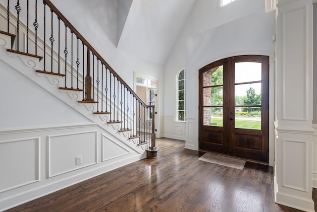 1825 Barnstaple Ln, Brentwood, TN 37027 - foyer entrance with a decorative wall, high vaulted ceiling, stairs, dark wood-style flooring, and french doors
