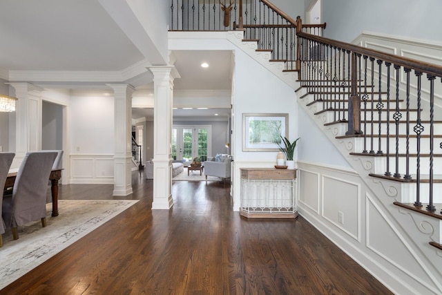1825 Barnstaple Ln, Brentwood, TN 37027 - foyer entrance featuring a decorative wall, ornate columns, stairway, crown molding, and wood finished floors