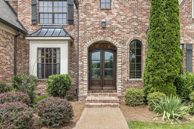 1825 Barnstaple Ln, Brentwood, TN 37027 - doorway to property with french doors, brick siding, and a standing seam roof