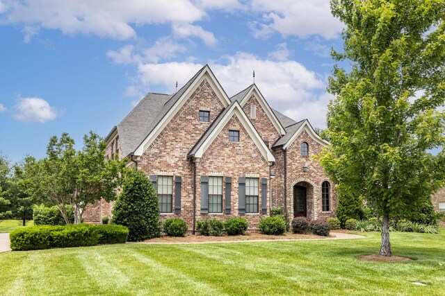 1825 Barnstaple Ln, Brentwood, TN 37027 - view of front facade with brick siding and a front lawn