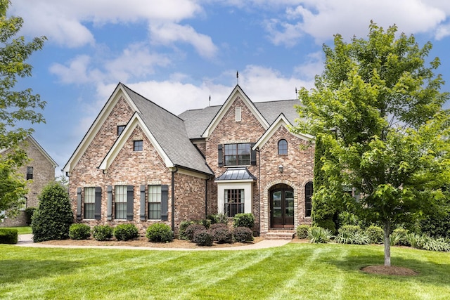 1825 Barnstaple Ln, Brentwood, TN 37027 - view of front of house with brick siding, a front lawn, a shingled roof, a standing seam roof, and french doors
