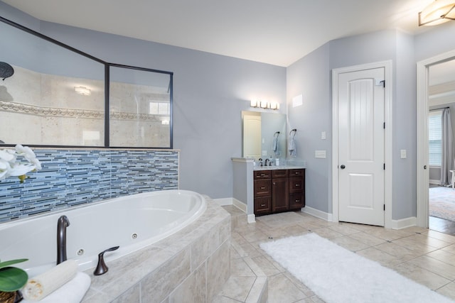1825 Barnstaple Ln, Brentwood, TN 37027 - bathroom with a jetted tub, vanity, tile patterned flooring, and baseboards